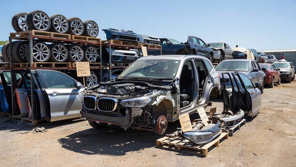 BMW X3 being dismantled at Wales Car Parts, Cwmbran, with parts stripped for resale