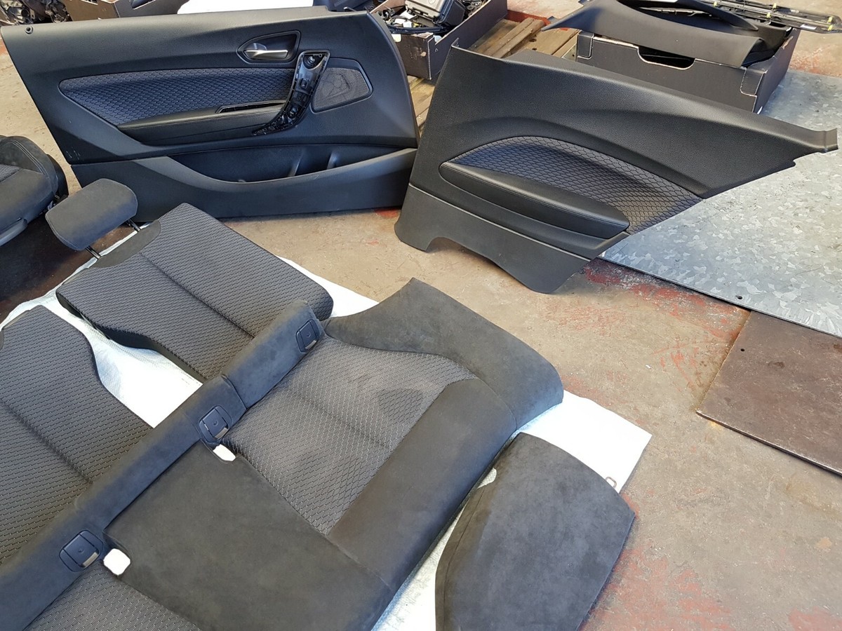 BMW interior parts: door cards, leather seat sections and trim ready to ship