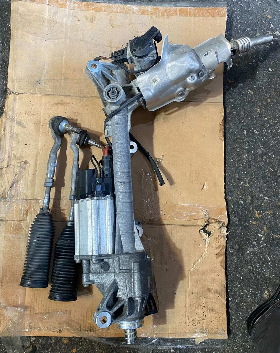 Used BMW steering rack assembly with electric assist, on the bench at our yard