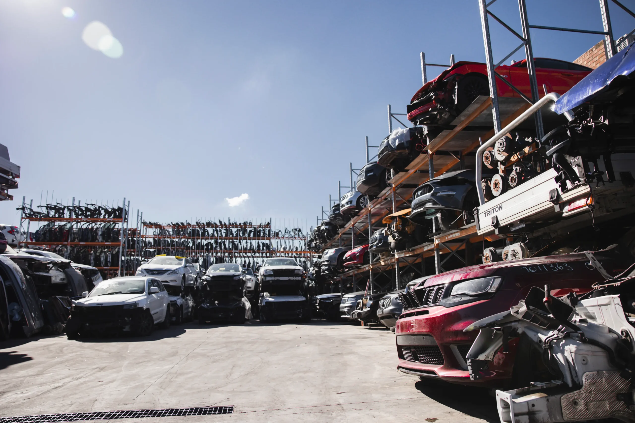 Audi dismantling yard at Wales Car Parts with bodyshells stacked on racks